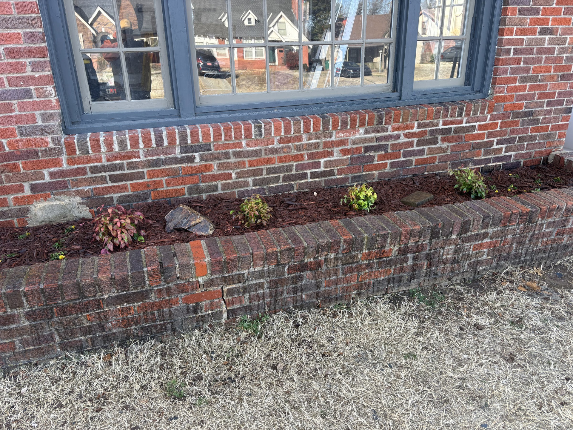 Brick planter bed after fresh landscaping
