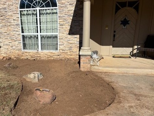Front bed cleared to clean soil